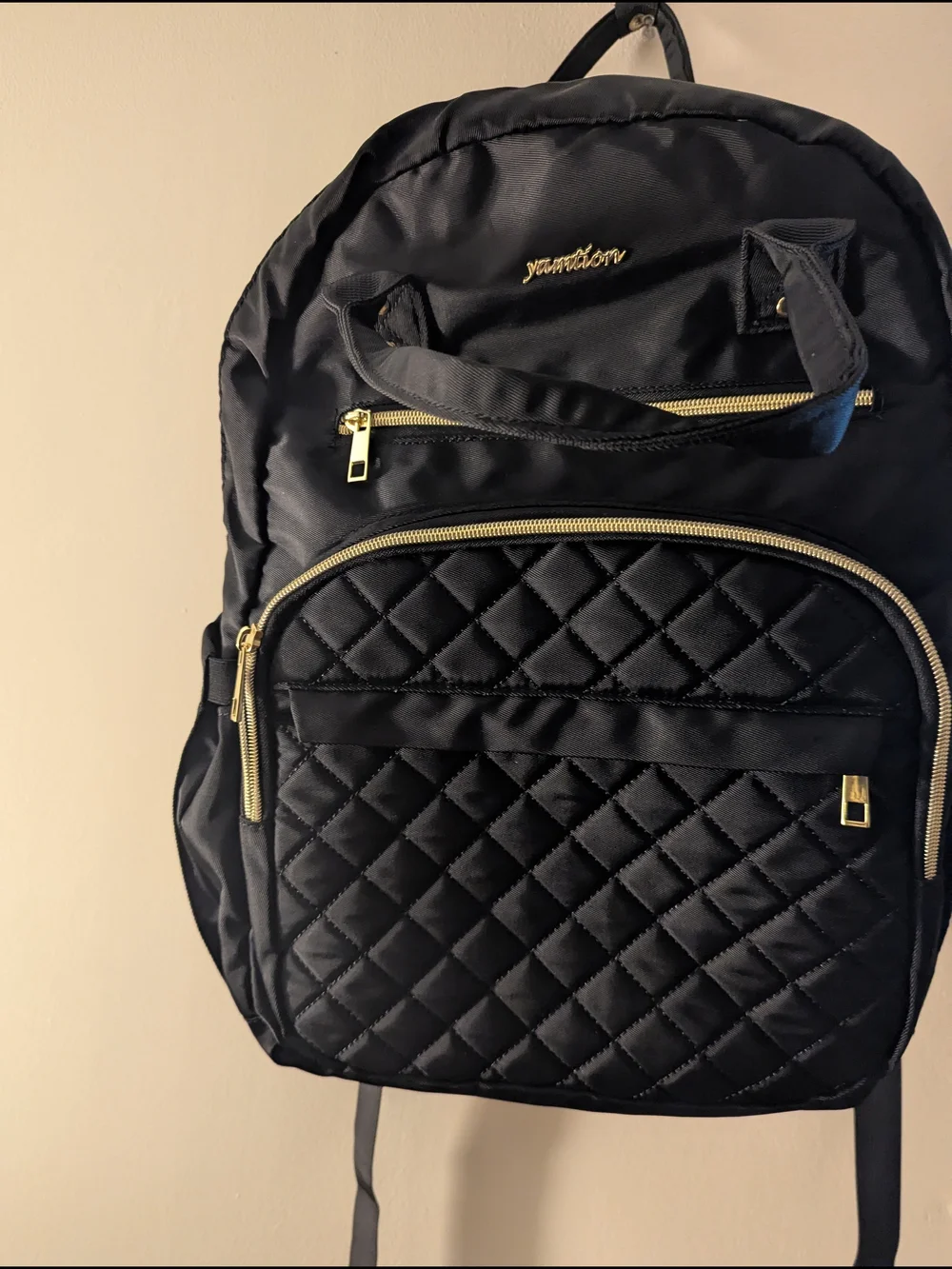 Black Quilted Backpack with Gold Accents